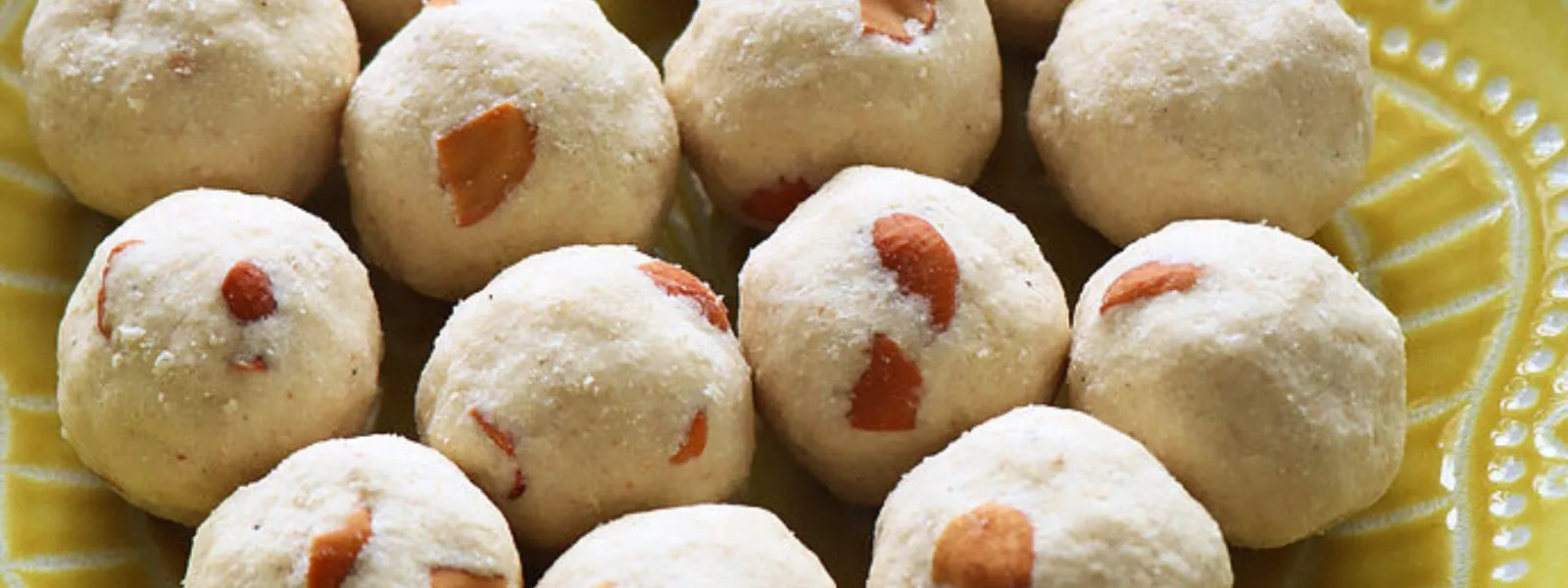 Rava Ladoo: Sweet, melt-in-your-mouth Indian ladoos made with semolina, sugar, and ghee.