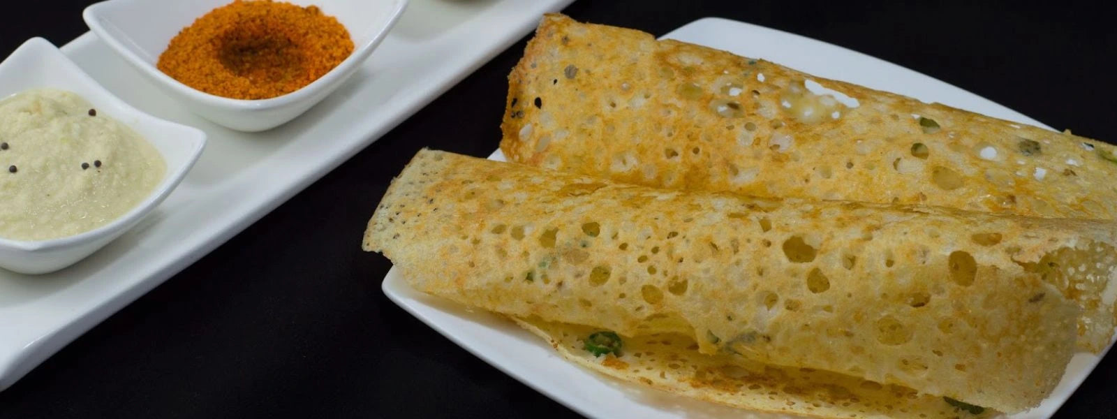 Crispy Rava Dosa: Thin, crispy South Indian dosa made with semolina and rice flour.